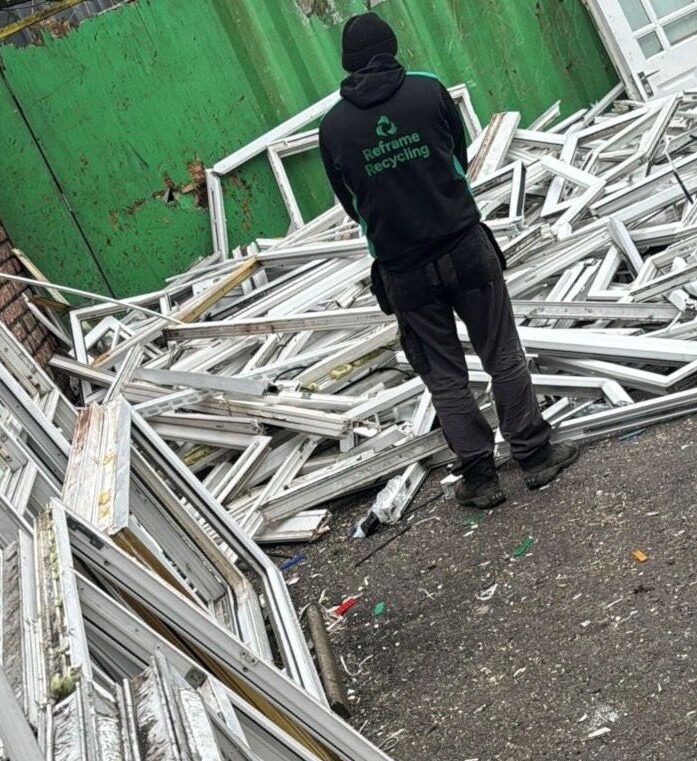 Commercial uPVC window frame collection ready for recycling in the North Wesr